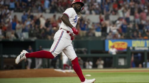 Texas Rangers' Adolis Garcia jogs around the bases after hitting a solo home run in the bottom of the seventh inning in a baseball game against the Houston Astros in Arlington, Texas, Monday, July 3, 2023. (AP Photo/Emil T. Lippe)