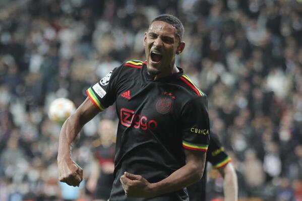 FILE - Ajax's Sebastien Haller celebrates scoring his side's second goal during the Champions League group C soccer match between Besiktas and Ajax at the Vodafone Park Stadium in Istanbul, Turkey, Wednesday, Nov. 24, 2021. Ivory Coast striker Sébastien Haller is back in training at Borussia Dortmund after nearly six months away from soccer with testicular cancer. Haller posted pictures Monday, Jan. 2, 2023, of himself training in the gym at Dortmund and said 2023 will see him return to the field. (AP Photo, File)