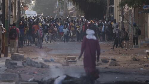 Demonstrators gather on a street during clashes with police at a neighborhood in Dakar, Senegal, Saturday, June 3, 2023. The clashes first broke out, later this week, after opposition leader Ousmane Sonko was convicted of corrupting youth and sentenced to two years in prison. (AP Photo/Leo Correa)