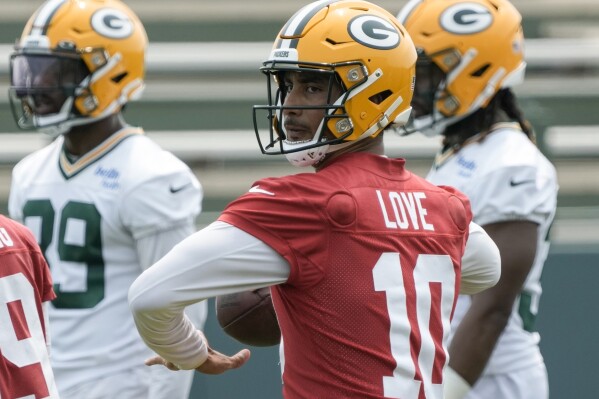 FILE - Green Bay Packers' Jordan Love drops back to pass during an NFL football mini camp practice session Wednesday, June 14, 2023, in Green Bay, Wis. The Packers have scheduled two separate sessions of joint practices to give new starting quarterback Jordan Love more opportunities to work with his young receiving group before the season begins. (AP Photo/Morry Gash, File)