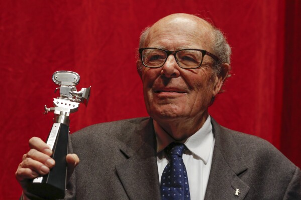 Director Marcel Ophuls shows the Berlinale Camera award after he is honored for his lifetime achievement during the 2015 Berlinale Film Festival in Berlin, Wednesday, Feb. 11, 2015. (AP Photo/Markus Schreiber, File)