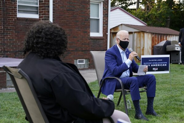 Democratic presidential candidate former Vice President Joe Biden speaks during a campaign event with steelworkers in the backyard of a home in Detroit, Wednesday, Sept. 9, 2020. (AP Photo/Patrick Semansky)