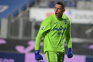 FILE - In this Sunday, Dec. 20, 2020 file photo, Atalanta goalkeeper Pierluigi Gollini yells out during the Italian Serie A soccer match between Atalanta and Roma at the Gewiss Stadium in Bergamo, Italy. Tottenham Hotspur signed Italian goalkeeper Pierluigi Gollini from Italian club Atalanta on a season-long loan with an option to make the move permanent, the team said Saturday July 24, 2021. (Fabio Rossi/LaPresse via AP, File)