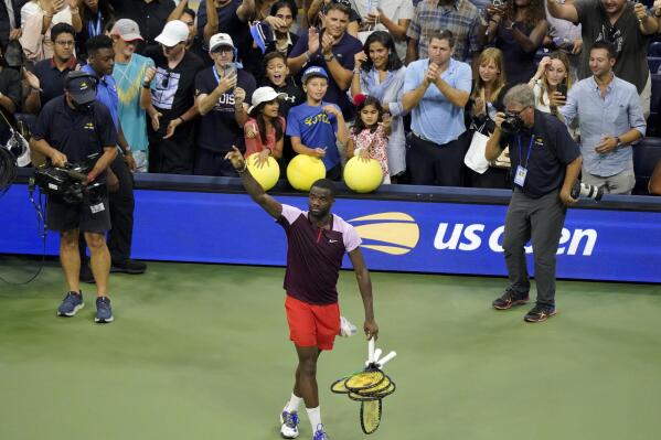 Frances Tiafoe, of the United States, gestures to the crowd after losing to Carlos Alcaraz, of Spain, in the semifinals of the U.S. Open tennis championships, Friday, Sept. 9, 2022, in New York. (AP Photo/Mary Altaffer)