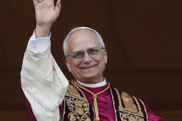 Newly elected Pope Leo XIV appears at the balcony of St. Peter's Basilica at the Vatican, Thursday, May 8, 2025. (AP Photo/Alessandra Tarantino)