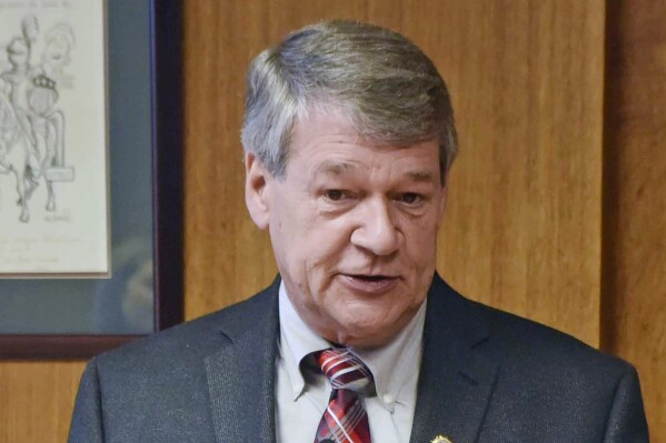 FILE - North Dakota Attorney General Wayne Stenehjem speaks in Bismarck, N.D., July 18, 2019. Thousands of state emails of North Dakota's late attorney general Stenehjem were released Wednesday, March 27, 2024, by his successor. The emails were previously thought to be gone forever, deleted at the direction of Stenehjem's executive assistant days after he died in January 2022. (Tom Stromme/The Bismarck Tribune via AP, File)