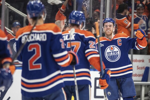 Edmonton Oilers' Connor McDavid (97) celebrates the win with teammates over the Los Angeles Kings during NHL playoff action in Edmonton on Thursday, May 1, 2025. (Jason Franson/The Canadian Press via AP)