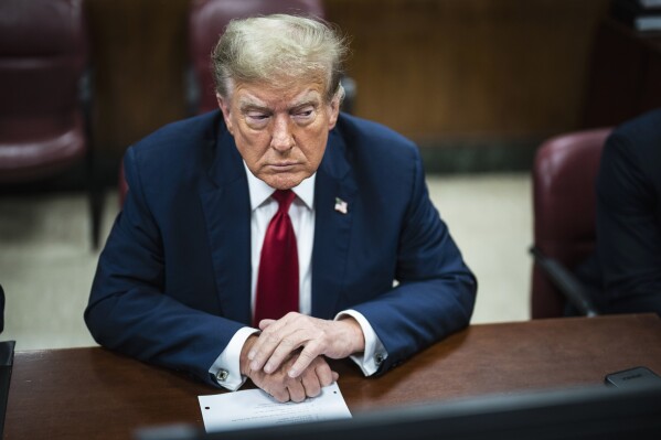 FILE - Former President Donald Trump is pictured in a Manhattan criminal court ahead of the start of jury selection in New York on April 15, 2024. The first day of Trump's history-making trial in Manhattan ended Monday with no one yet chosen to be among the panel of 12 jurors and six alternates. Dozens of people were dismissed after saying they didn't believe they could be fair, though dozens of other prospective jurors have yet to be questioned. (Photo by Jabin Botsford/Washington Post via AP, Pool, File)