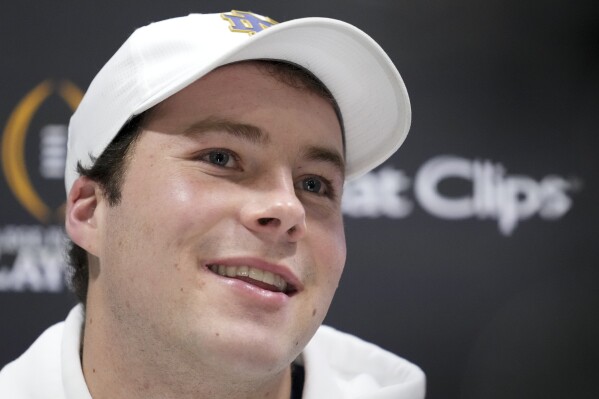 Notre Dame quarterback Riley Leonard talks during media day ahead of the College Football Playoff national championship game between Ohio State and Notre Dame, Saturday, Jan. 18, 2025, in Atlanta. The game will be played on Monday. (AP Photo/Brynn Anderson)