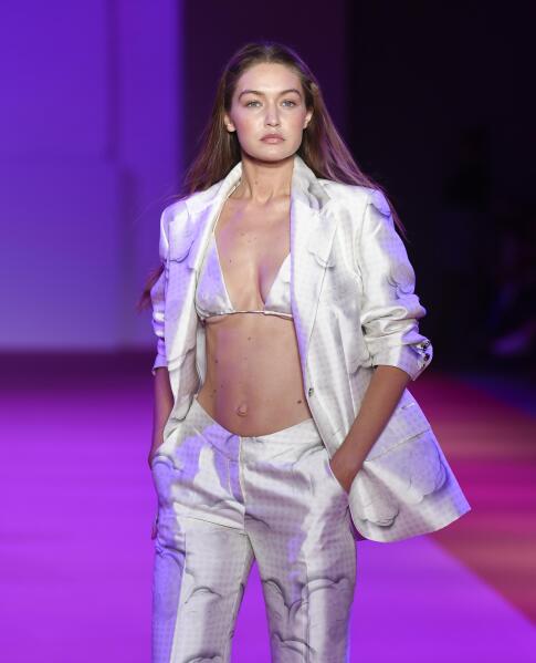 Model Gigi Hadid presents a creation from the Brandon Maxwell Fall