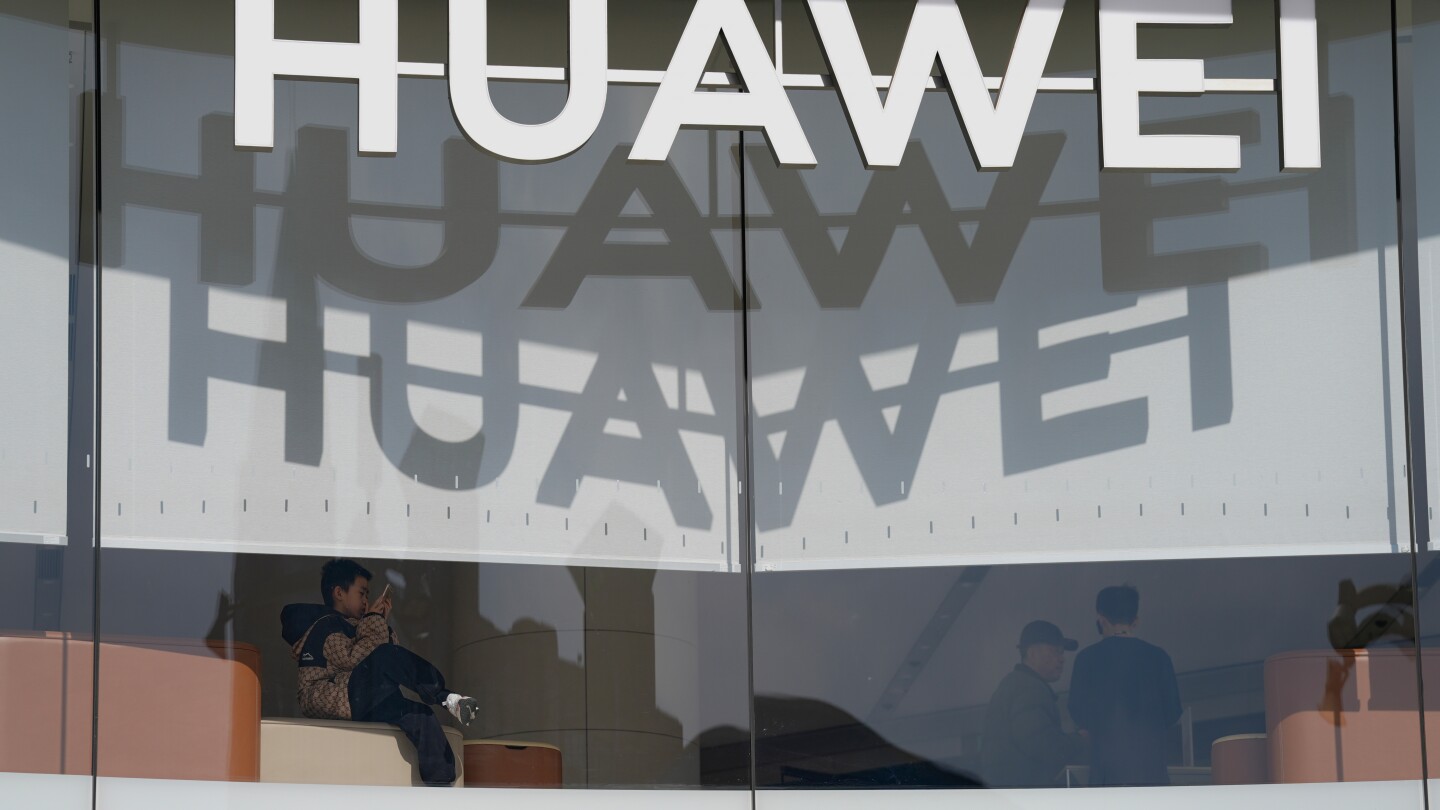 China's telecoms giant Huawei Technologies says its profit fell 28% while revenue surged in 2024