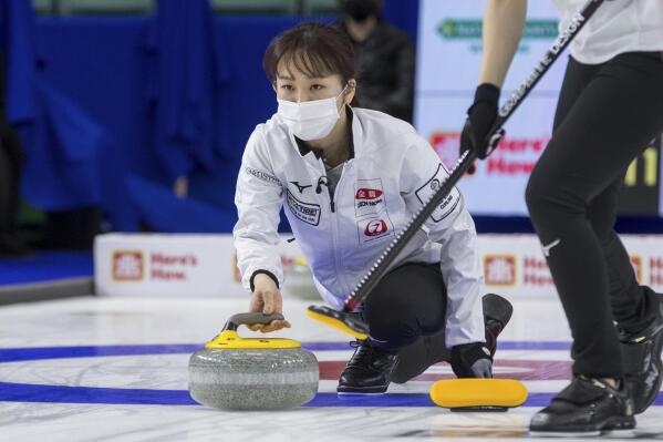 Japan skip Ikue Kitazawa throws a stone against Switzerland at the Women's World Curling Championships in Prince George, British Columbia, Friday, March 25, 2022. (James Doyle/The Canadian Press via AP)