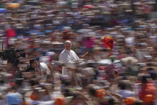 Pope Leo XIV arrives on his pope mobile before celebrating a Mass for the Jubilee of Families in St. Peter's Square, at the Vatican, Sunday, June 1, 2025. (AP Photo/Andrew Medichini)