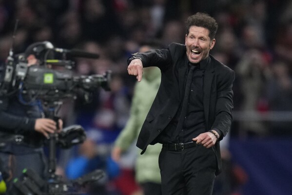 FILE - Atletico Madrid's head coach Diego Simeone celebrates at the end of the Champions League, round of 16, second leg soccer match against Inter Milan at the Metropolitano stadium in Madrid, Spain, on March 13, 2024. Atletico Madrid hosts Athletic Bilbao on Saturday in a game that could go a long way to deciding which goes to Europe’s elite competition next season. Atletico currently holds fourth place, but Diego Simeone’s side only has a three-point advantage over Athletic in fifth with six games remaining. (AP Photo/Manu Fernandez, File)
