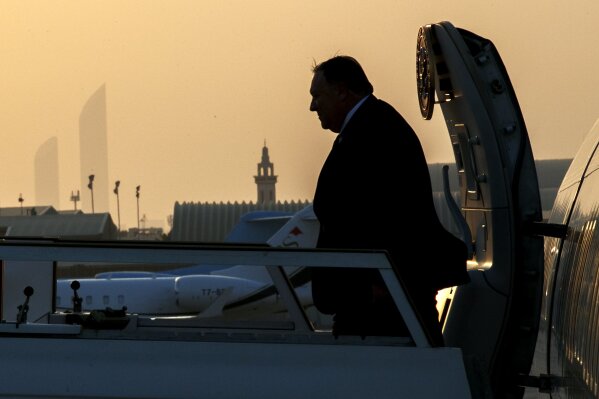 Secretary of State Mike Pompeo exits the plane at sunset as he arrives in Abu Dhabi, United Arab EmiratesMonday, June 24, 2019, for meetings on Iran. (AP Photo/Jacquelyn Martin, Pool)