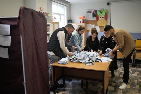 Election representatives count votes at a polling station in Istanbul, Turkey, Sunday, March 31, 2024. Turkey holds local elections on Sunday that will decide who will control Istanbul and other major cities.  (AP Photo/Emrah Gurel)
