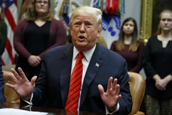 President Donald Trump speaks during an event where he congratulated astronauts Jessica Meir and Christina Koch as they conduct the first all-female spacewalk, from the Roosevelt Room of the White House, Friday, Oct. 18, 2019, in Washington. (AP Photo/Evan Vucci)