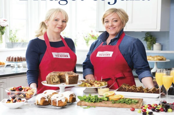 
              This image provided by America's Test Kitchen in September 2018 shows the cover for the cookbook “Cooking At Home With Bridget and Julia.” It includes a recipe for New Orleans bourbon bread pudding with bourbon sauce. (America's Test Kitchen via AP)
            