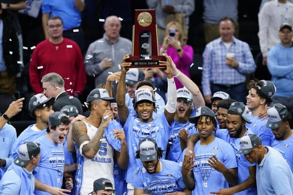 North Carolina players celebrate after North Carolina won a college basketball game against St. Peter's in the Elite 8 round of the NCAA tournament, Sunday, March 27, 2022, in Philadelphia. (AP Photo/Matt Rourke)