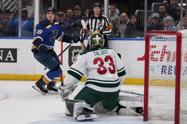 St. Louis Blues' Robert Thomas (18) celebrates after scoring the game-winning goal past Minnesota Wild goaltender Cam Talbot (33) in overtime of an NHL hockey game Friday, April 8, 2022, in St. Louis. (AP Photo/Jeff Roberson)