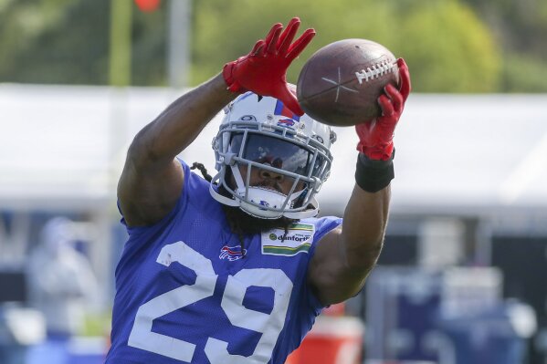FILE - In this Aug. 18, 2020, file photo, Buffalo Bills cornerback Josh Norman (29) catches a pass during a fumble drill on the second day of training camp in Orchard Park, N.Y., Tuesday, Aug. 18, 2020. Buffalo Bills cornerback Josh Norman is out indefinitely after hurting his left hamstring in practice.C oach Sean McDermott on Friday, Aug. 21, 2020, couldn’t provide a timetable on time Norman will miss, saying the team is still determining the severity of the injury.(James P. McCoy/Buffalo News via AP, Pool)