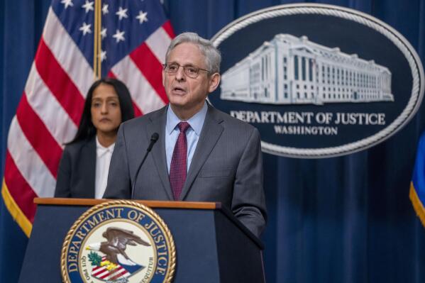 Attorney General Merrick Garland, accompanied by Associate Attorney General Vanita Gupta, left, speaks during a news conference, Tuesday, March 7, 2023, in Washington. The Biden administration sued on Tuesday to block JetBlue Airways' $3.8 billion purchase of Spirit Airlines, saying the deal would reduce competition and drive up air fares for consumers. (AP Photo/Alex Brandon)