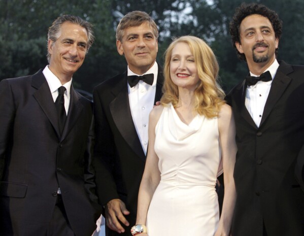 Actor David Strathairn, from left, writer-director-producer George Clooney, actor Patricia Clarkson, and producer Grant Heslov, appear at the screening of their film, "Good Night, and Good Luck" at the 62nd edition of the Venice Film Festival in Venice, northern Italy, on Sept. 1, 2005. (AP Photo/Domenico Stinellis, File)