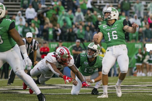 FILE - In this Oct. 26, 2019, file photo, Marshall kicker Justin Rohrwasser (16) hits a 53-yard game winning field goal against Western Kentucky during an NCAA college football game in Huntington, W.Va. New Patriots kicker Justin Rohrwasser says a tattoo on his arm is not representative of a loosely organized right-wing militia group that has adopted the symbol. Rohrwasser, who played at Rhode Island and Marshall, was taken 159th overall in the fifth round of the draft Saturday, April 25, 2020.
(Sholten Singer/The Herald-Dispatch via AP, File)