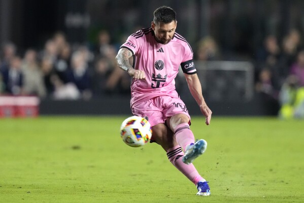 Inter Miami forward Lionel Messi takes a free kick during the first half of the team's MLS soccer match against Real Salt Lake, Wednesday, Feb. 21, 2024, in Fort Lauderdale, Fla. (AP Photo/Lynne Sladky)