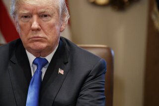 President Donald Trump listens during a cabinet meeting at the White House, Wednesday, Dec. 20, 2017, in Washington. (AP Photo/Evan Vucci)