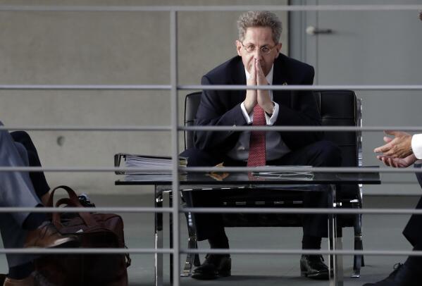 FILE -- In this Wednesday, Sept. 12, 2018 photo Hans-Georg Maassen, then head of the German Federal Office for the Protection of the Constitution, waits for the beginning of a hearing at the home affairs committee of the German federal parliament, Bundestag, in Berlin, Germany. The center-right Christian Democratic Union two weeks ago gave Hans-Georg Maassen an ultimatum to leave the party by Feb. 5, which he ignored. On Monday, party leader Friedrich Merz said the CDU leadership decided unanimously to start expulsion proceedings and withdraw his membership rights with immediate effect. (AP Photo/Michael Sohn, file)