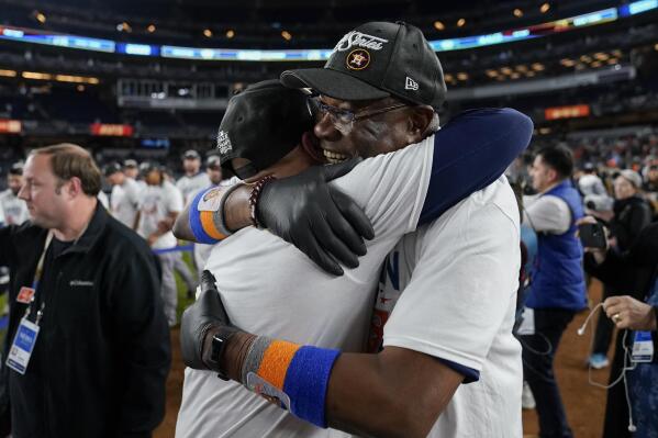 Houston Astros manager Dusty Baker Jr. left, celebrates with the team on the field after defeating the New York Yankees in Game 4 to win the American League Championship baseball series, Monday, Oct. 24, 2022, in New York. (AP Photo/John Minchillo)