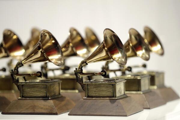 FILE - Various Grammy Awards are displayed at the Grammy Museum Experience at Prudential Center in Newark, N.J, on Oct. 10, 2017. The 2023 Grammy Awards will air live Sunday, Feb. 5. (AP Photo/Julio Cortez, File)