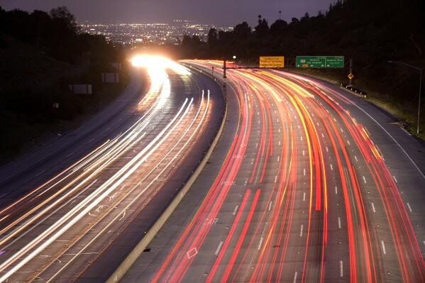 Traffic slowly moves along Interstate 405 on Thursday, May 23, 2024, in the Bel Air section of Los Angeles. Highways and airports are likely to be jammed in the coming days as Americans head out on and home from Memorial Day weekend getaways. (AP Photo/Mark J. Terrill)