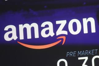 FILE - The price of Amazon stock is shown on a screen at the Nasdaq MarketSite, Wednesday, Dec. 20, 2017, in New York. Amazon reports earnings on Thursday, April 27, 2023. (AP Photo/Mark Lennihan, File)