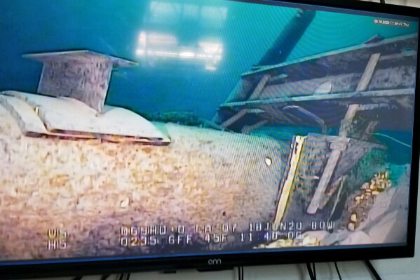 In this photo shot from a television screen provided by the Michigan Department of Environment, Great Lakes, and Energy in June 2020, shows damage to anchor support EP-17-1 on the east leg of the Enbridge Line 5 pipeline within the Straits of Mackinac in Mich. (Michigan Department of Environment, Great Lakes, and Energy via AP, File)