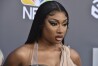 FILE - Megan Thee Stallion arrives at the Billboard Music Awards at the MGM Grand Garden Arena, May 15, 2022, in Las Vegas. A photographer who worked for the hip-hop star said in a lawsuit filed Tuesday, April 23, 2024, that he was forced to watch her have sex, was unfairly fired soon after and was abused as her employee. (Photo by Jordan Strauss/Invision/AP, File)