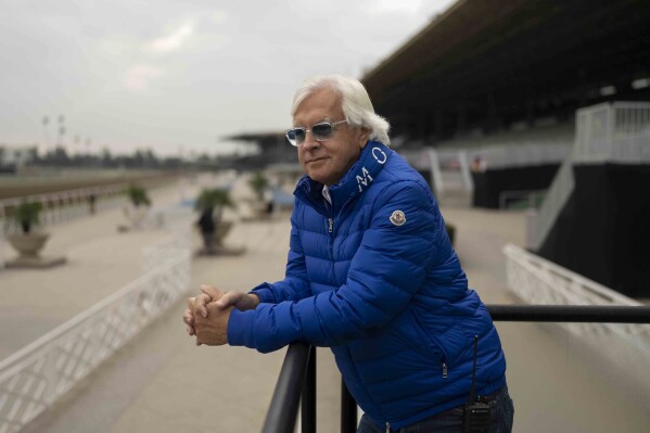 FILE - Trainer Bob Baffert stands for a photo ahead of the Breeders' Cup horse races at Santa Anita in Arcadia, Calif., Oct. 27, 2023. A judge has denied a request by the owner of Baffert-trained Arkansas Derby winner Muth for the colt to run in next month’s 150th Kentucky Derby at Churchill Downs. Jefferson County (Ky.) Circuit Judge Mitch Perry declined Thursday, April 18, to grant a temporary injunction to Zedan Racing Stables, which had argued that the ban of Baffert was “illegal.” (AP Photo/Jae C. Hong, File)