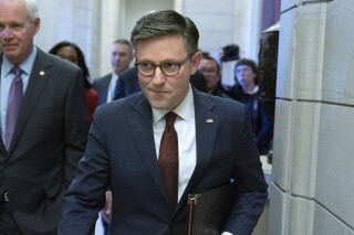 Speaker of the House Rep. Mike Johnson, R-La., walks to the senate side for lunch with Senate GOP members at the Capitol Washington, Wednesday, Nov. 1, 2023. (AP Photo/Jose Luis Magana)