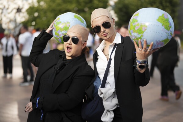 Fans gather in front of the O2 Arena prior to a performance by Pitbull on Monday, June 9, 2025, in London. (Photo by Scott A Garfitt/Invision/AP)