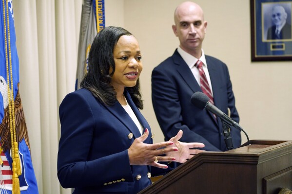 FILE - Assistant Attorney General Kristen Clarke of the U.S. Department of Justice Civil Rights Division announces an investigation into the City of Lexington, Miss., and the Lexington Police Department, Wednesday, Nov. 8, 2023, in Jackson, Miss. as U.S. Attorney Todd W. Gee looks on. The Lexington police department unconstitutionally jailed people for unpaid fines without first assessing whether they could afford to pay them, the U.S. Department of Justice said Thursday, Feb. 29, 2024. (AP Photo/Rogelio V. Solis, File)