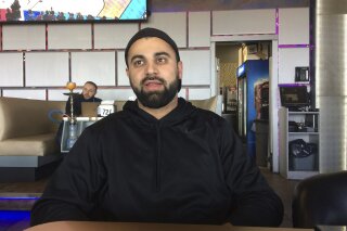 
              In this photo taken March 16, 2017, Hussein Dabajeh, 30, a lifelong Dearborn, Mich. resident who owns a hookah shop and lounge, said his ancestors first came to the U.S. from what’s now Lebanon in 1911. Still, he usually looks for the “other” box when offered the option on official forms and fully supports the idea of a new category for those who trace their roots to the Middle East. (AP Photo/Jeff Karoub)
            