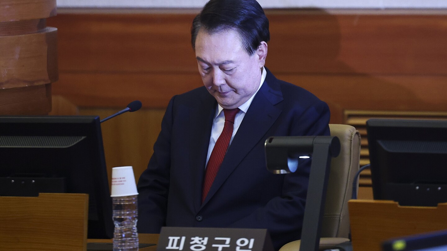 South Korea’s Yoon defends his martial regulation decree in his first public look since his arrest