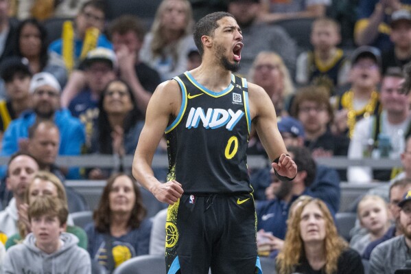 Indiana Pacers guard Tyrese Haliburton (0) reacts after forcing a Brooklyn Nets turnover during the second half of an NBA basketball game in Indianapolis, Saturday, March 16, 2024. (AP Photo/Doug McSchooler)