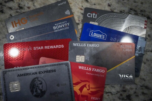 FILE - A variety of credit cards are shown on Jan. 18, 2024, in Atlanta. Seriously overdue credit card debt is at the highest level in 14 years, and people 35 and under are struggling more than other age groups to pay their bills. (ĢӰԺ Photo/Mike Stewart, File)