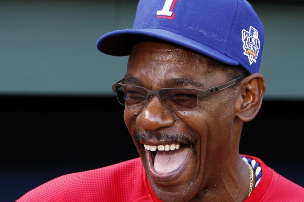 FILE - Texas Rangers manager Ron Washington laughs as his team warms up before Game 4 of baseball's World Series against the San Francisco Giants Sunday, Oct. 31, 2010, in Arlington, Texas. Ron Washington often reflects on his first managerial job, and taking the Texas Rangers to their first two World Series appearances. (AP Photo/Matt Slocum, File)