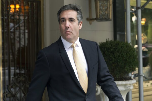 
              Michael Cohen, former personal lawyer to President Donald Trump, leaves his apartment building, in New York, Tuesday, Aug. 21, 2018.  (AP Photo/Richard Drew)
            