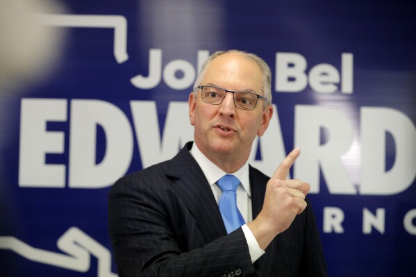 FILE - Louisiana Gov. John Bel Edwards talks to media at his campaign office in Shreveport, La., Nov. 14, 2019. Following pleas from Louisiana lawmakers for Edwards to clean up the state’s budget that was hastily passed, the Democrat on Thursday, June 29, 2023, steered a chunk of money away from paying down debt to increase funding for the health department and early childhood education. (AP Photo/Gerald Herbert, File)