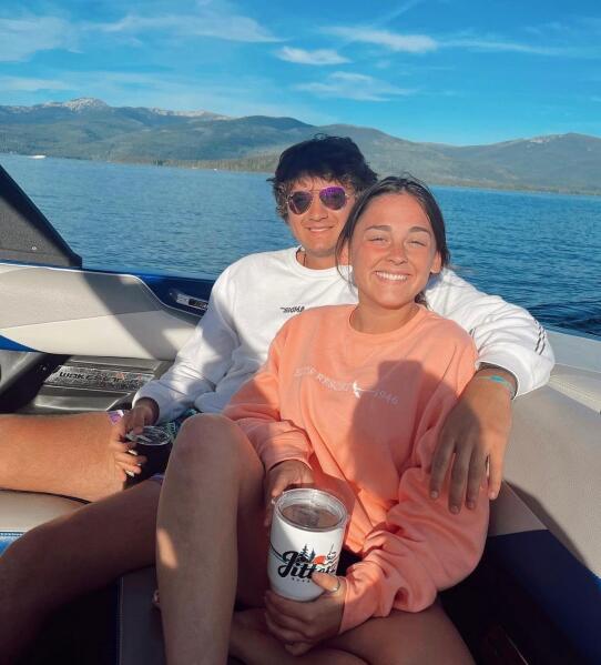This July 2022 photo provided by Jazzmin Kernodle shows University of Idaho students Xana Kernodle, right, and Ethan Chapin on a boat on Priest Lake, in Idaho.  Both students were among four found stabbed to death in an off-campus rental home on Nov. 13.  (Jazzmin Kernodle via AP)