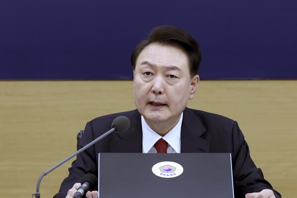 South Korean President Yoon Suk Yeol speaks during a cabinet meeting at the government complex in Sejong, South Korea, Wednesday, March 6, 2024. The prolonged walkouts by junior doctors won't be tolerated, South Korea’s president said Wednesday, calling them "an illegal collective action" that threatens public health and shakes the country’s governing systems. (Jin Sung-chul/Yonhap via AP)